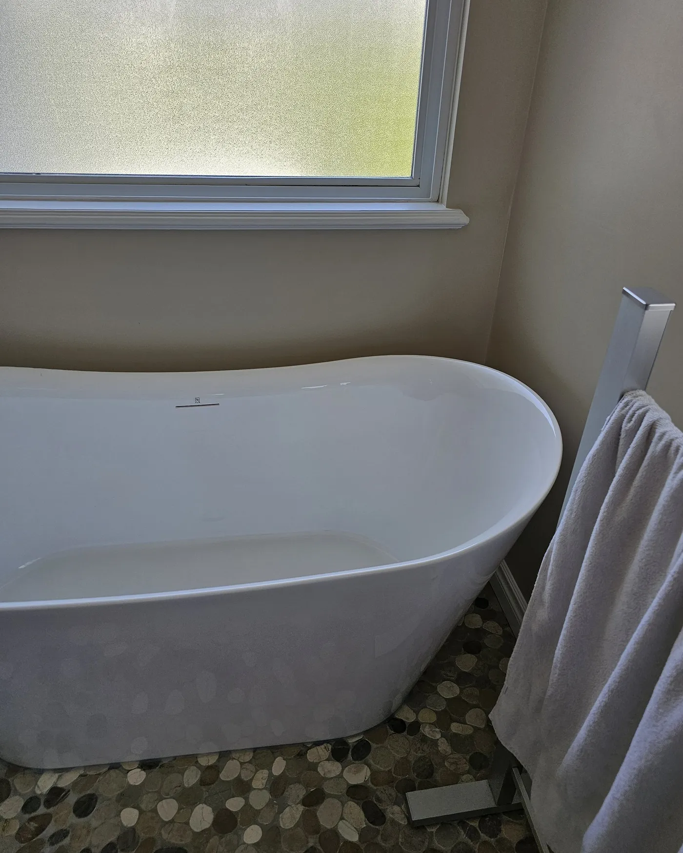 Bathroom renovation in Port Coquitlam by PS Tiling: Tub by the window, after.