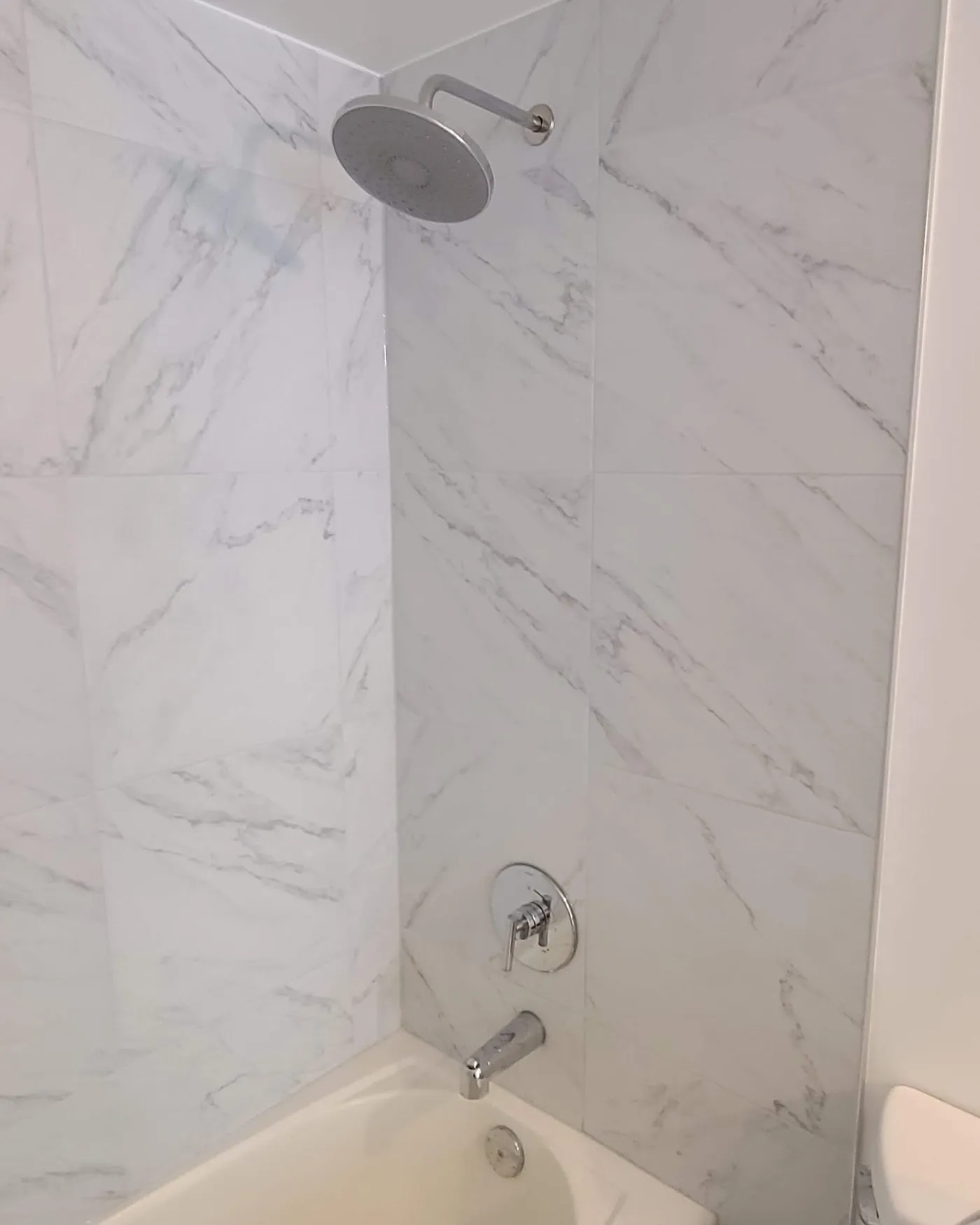 Bathroom renovation in Vancouver by PS Tiling: Tub surround, after.