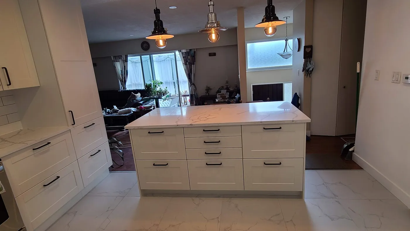Kitchen renovation in Port Moody by PS Tiling: Island and pendant lights, after.