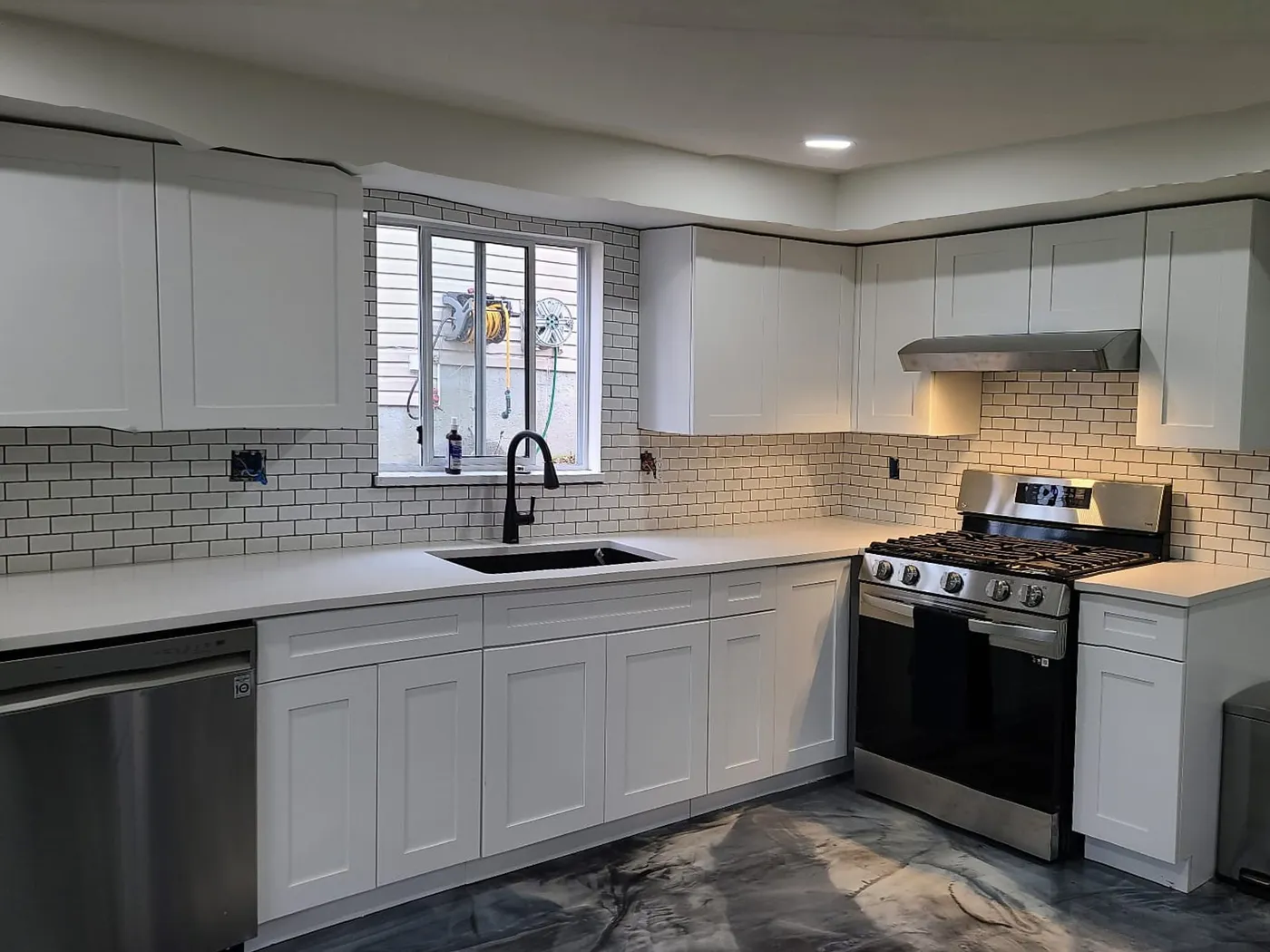 Kitchen renovation in Port Moody by PS Tiling: Sink wall, after.