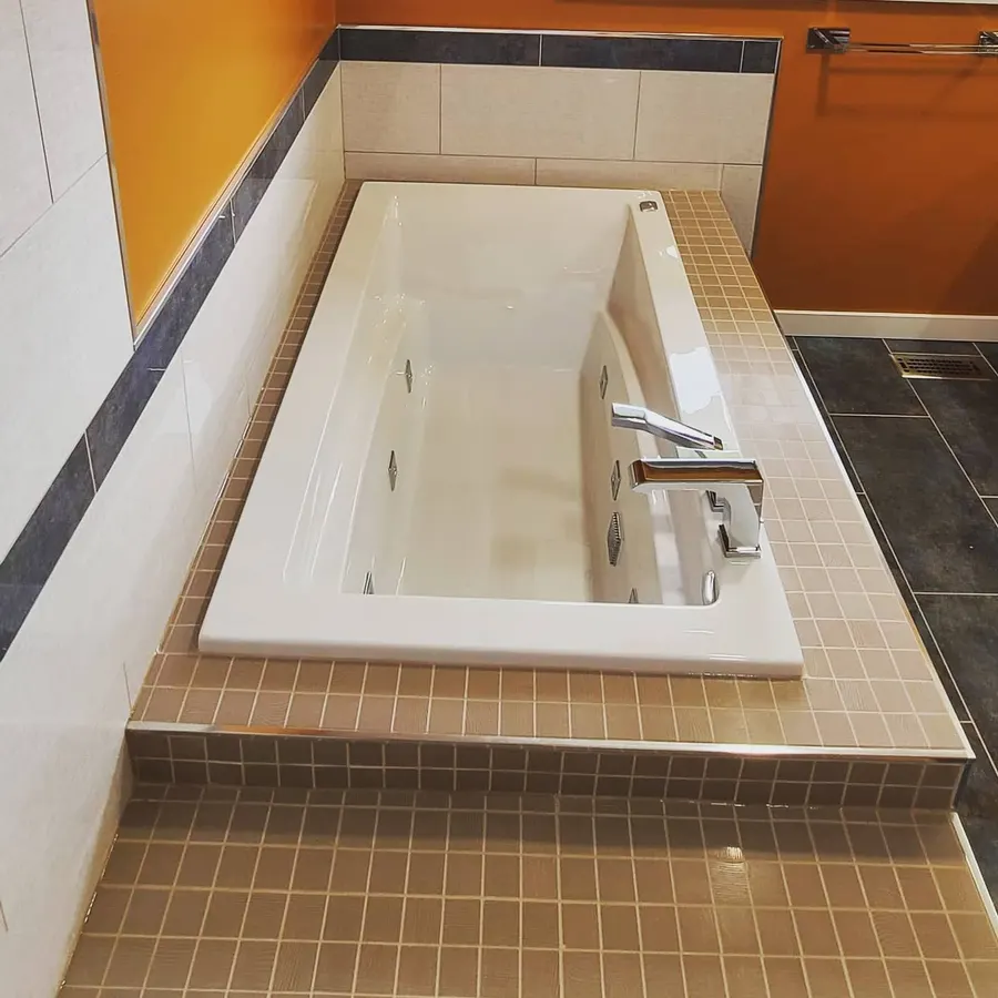 Shower renovation in Delta by PS Tiling: drop-in tub with beige mosaic tile deck, finished.